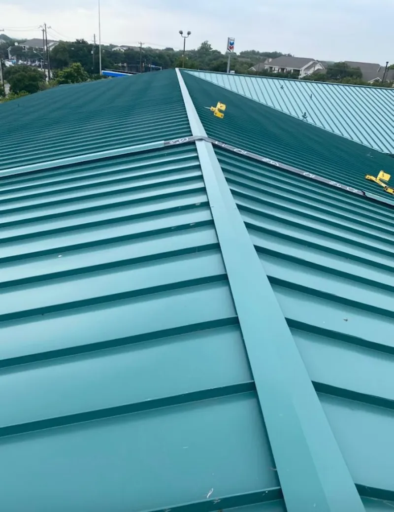 Green commercial metal roof ridge and valley for Metal Roof Repair in St. Joseph