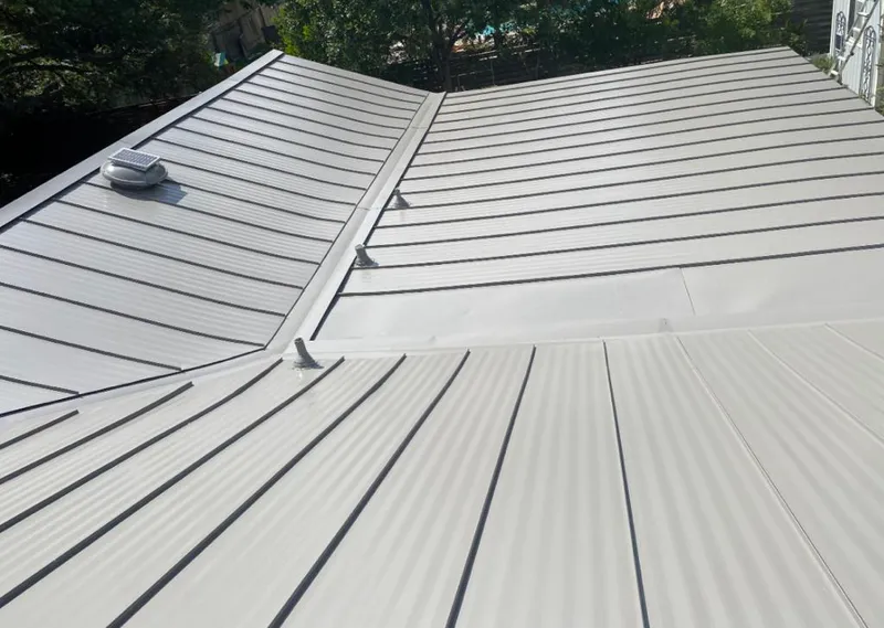 Solar attic fan installed on a metal roof for Roof Ventilation in St. Joseph